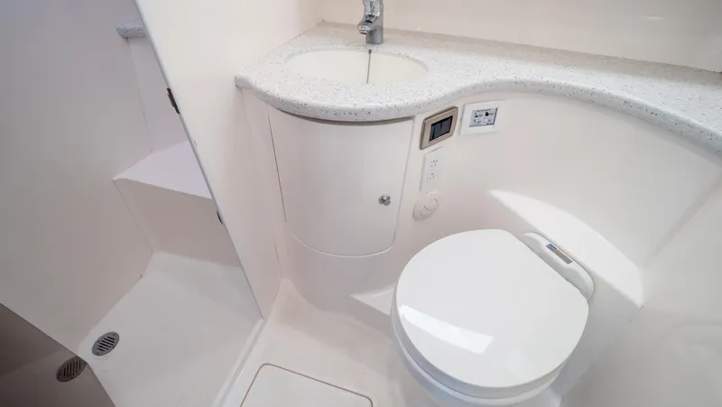  Yacht Photos Pics 2015 Intrepid 400 Cuddy bathroom with modern sink and toilet.
