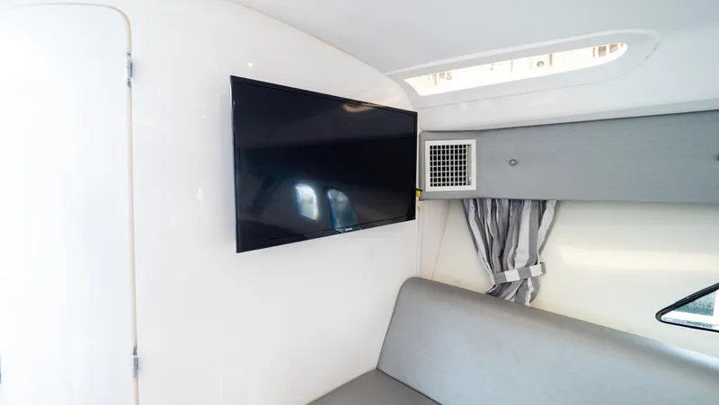  Yacht Photos Pics Interior of 2015 Intrepid 400 Cuddy with TV and seating area.