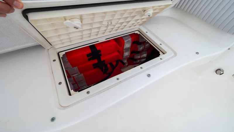  Yacht Photos Pics Storage compartment with life jackets on a 2015 Intrepid 400 Cuddy boat.