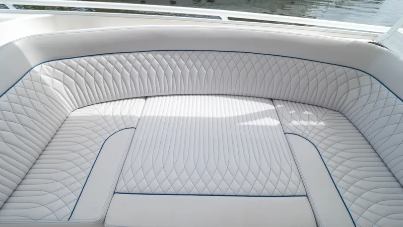  Yacht Photos Pics Luxurious seating on 2015 Intrepid 400 Cuddy boat with elegant white upholstery.