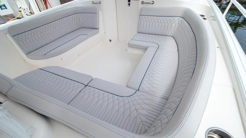  Yacht Photos Pics 2015 Intrepid 400 Cuddy boat interior with cushioned seating.
