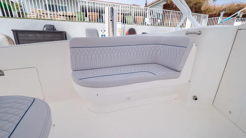  Yacht Photos Pics 2015 Intrepid 400 Cuddy boat interior with cushioned seating.