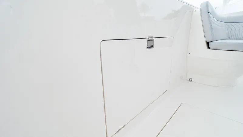  Yacht Photos Pics 2015 Intrepid 400 Cuddy interior detail, featuring sleek white paneling and seating.