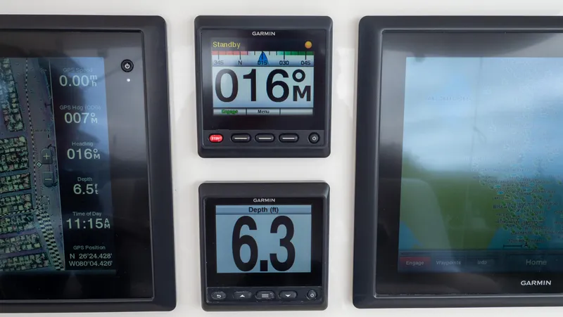  Yacht Photos Pics Garmin navigation displays on a 2015 Intrepid 400 Cuddy boat dashboard.
