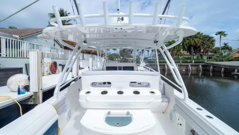  Yacht Photos Pics 2015 Intrepid 400 Cuddy boat docked, showcasing sleek design and spacious deck.