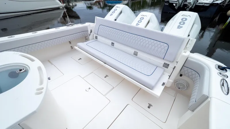  Yacht Photos Pics 2015 Intrepid 400 Cuddy boat with foldable seating and triple outboard engines.