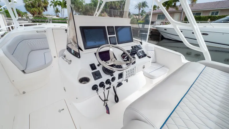  Yacht Photos Pics 2015 Intrepid 400 Cuddy boat helm with modern controls and seating.