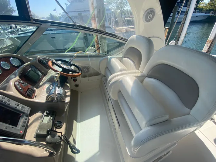 No Fly Zone Yacht Photos Pics 2003 Sea Ray 340 Sundancer helm with dual seats and navigation controls.