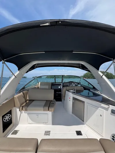 Wine-n-down Yacht Photos Pics 2014 Regal 32 Express boat interior with seating, canopy, and ocean view.