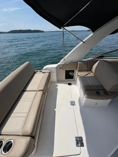 Wine-n-down Yacht Photos Pics 2014 Regal 32 Express boat interior with beige seating and ocean view.