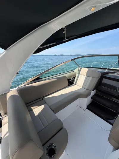 Wine-n-down Yacht Photos Pics 2014 Regal 32 Express boat interior with beige seating, ocean view, and sleek design.