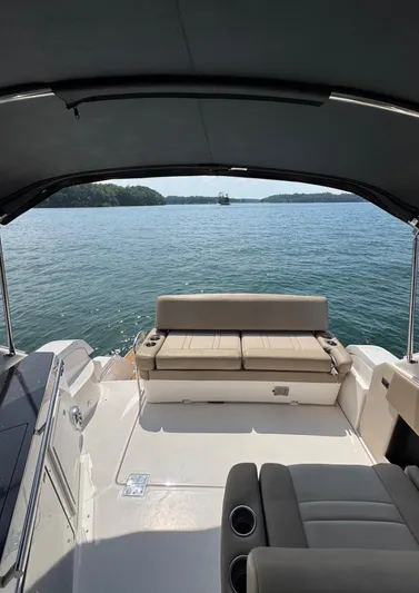 Wine-n-down Yacht Photos Pics 2014 Regal 32 Express boat interior with lake view under canopy.