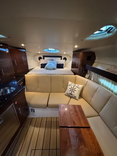 Wine-n-down Yacht Photos Pics Interior of 2014 Regal 32 Express yacht with cozy seating and elegant wood finishes.