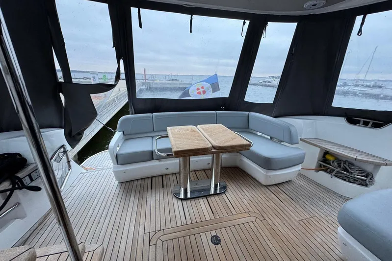  Yacht Photos Pics Luxurious 2021 Princess F45 yacht interior with elegant seating and wooden flooring.