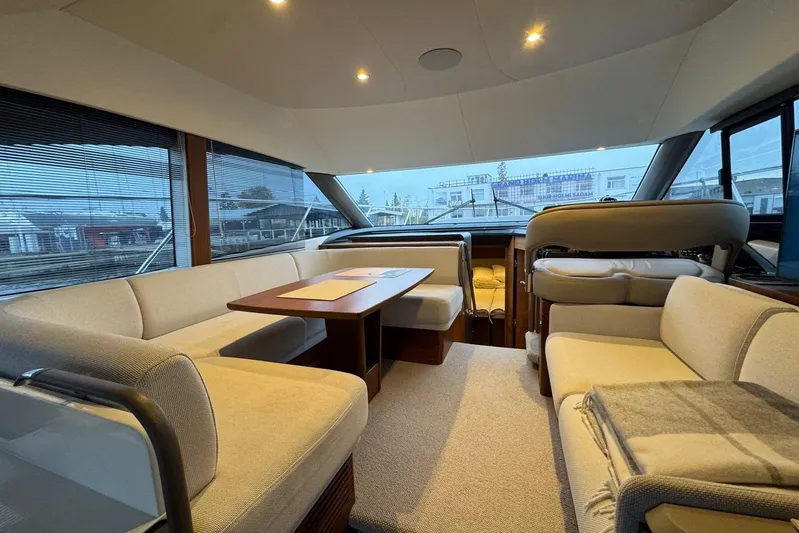  Yacht Photos Pics Luxurious interior of a 2021 Princess F45 yacht with elegant seating and dining area.