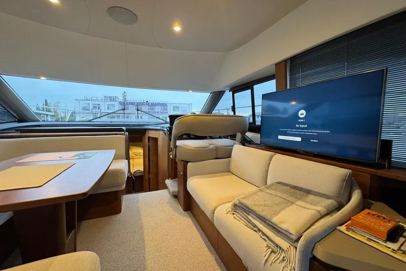  Yacht Photos Pics Luxurious interior of 2021 Princess F45 yacht with modern seating and entertainment system.