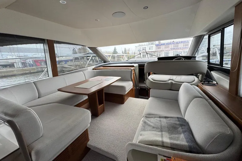  Yacht Photos Pics Luxurious interior of 2021 Princess F45 yacht with elegant seating and panoramic windows.