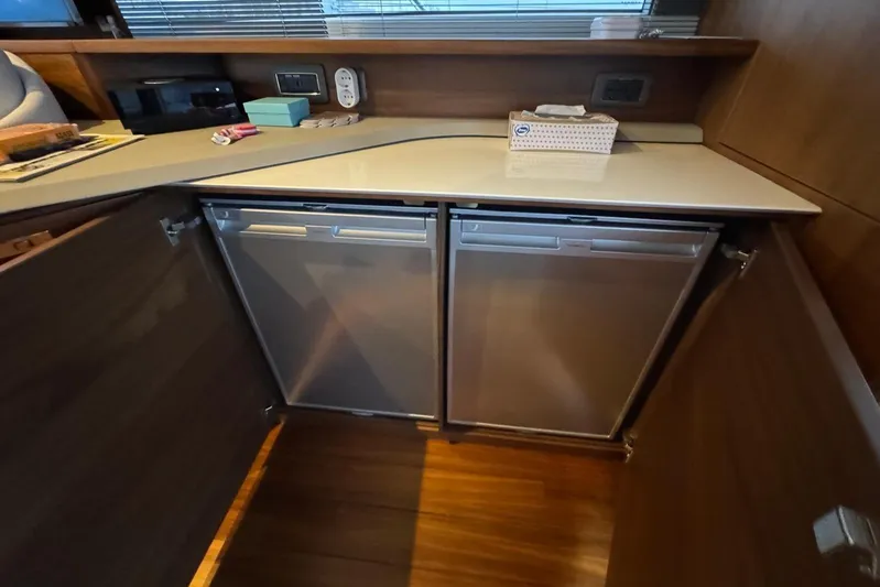  Yacht Photos Pics Modern kitchen area in 2021 Princess F45 yacht with sleek cabinetry and appliances.