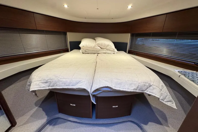  Yacht Photos Pics Luxurious cabin interior of 2021 Princess F45 yacht with cozy bedding.