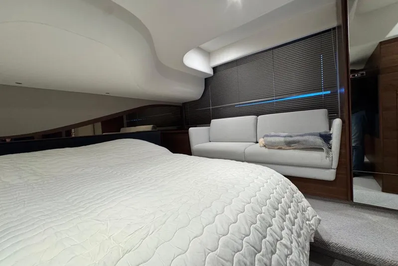  Yacht Photos Pics Luxurious interior of 2021 Princess F45 yacht with bed and sofa.