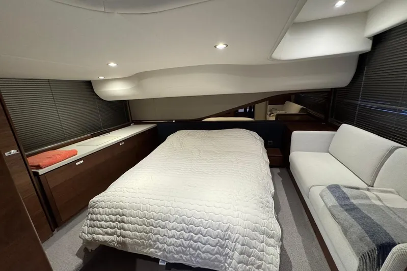  Yacht Photos Pics Luxurious 2021 Princess F45 yacht bedroom with modern decor and cozy ambiance.
