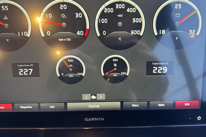  Yacht Photos Pics Garmin display showing engine metrics on 2021 Princess F45 yacht dashboard.
