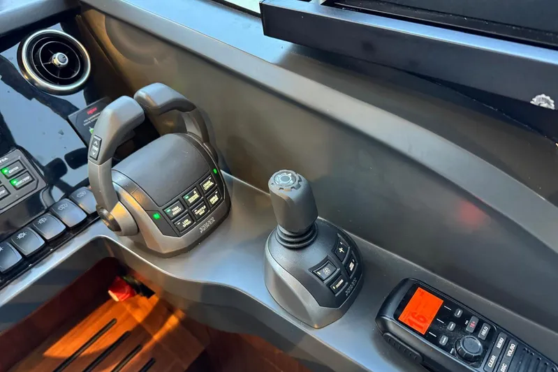  Yacht Photos Pics Control panel of a 2021 Princess F45 yacht with joystick and radio.