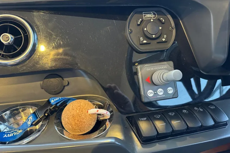  Yacht Photos Pics Control panel of a 2021 Princess F45 yacht with joystick and switches.