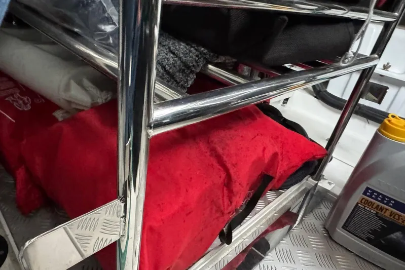  Yacht Photos Pics Storage area on a 2021 Princess F45 yacht with red bag and coolant container.