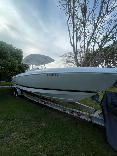  Yacht Photos Pics 2016 Intrepid 327 Center Console boat on a trailer.