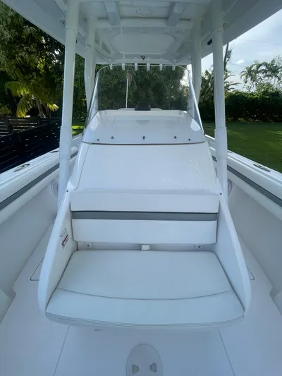  Yacht Photos Pics 2016 Intrepid 327 Center Console boat interior with white seating and console.