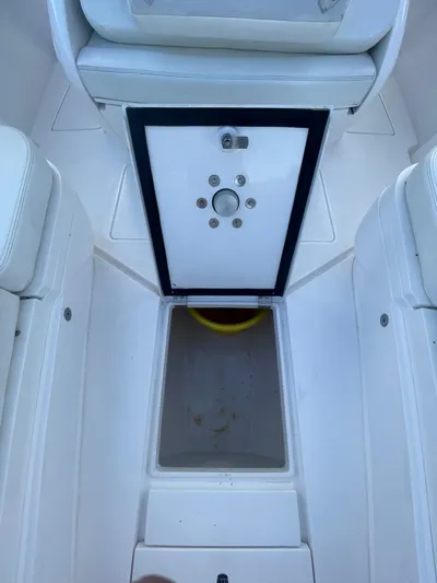  Yacht Photos Pics 2016 Intrepid 327 Center Console interior seating and storage area.