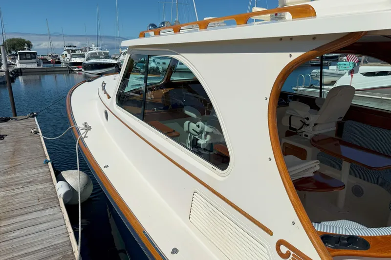 Madeline Kathleen Yacht Photos Pics 2003 Hinckley Talaria 40 yacht docked at marina, showcasing elegant design and craftsmanship.