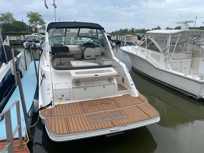  Yacht Photos Pics 2015 Sea Ray 350 Sundancer docked, featuring spacious deck and seating area.