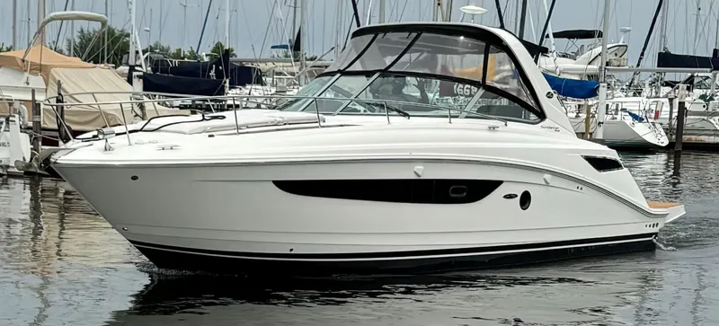  Yacht Photos Pics 2015 Sea Ray 350 Sundancer yacht docked in a marina.