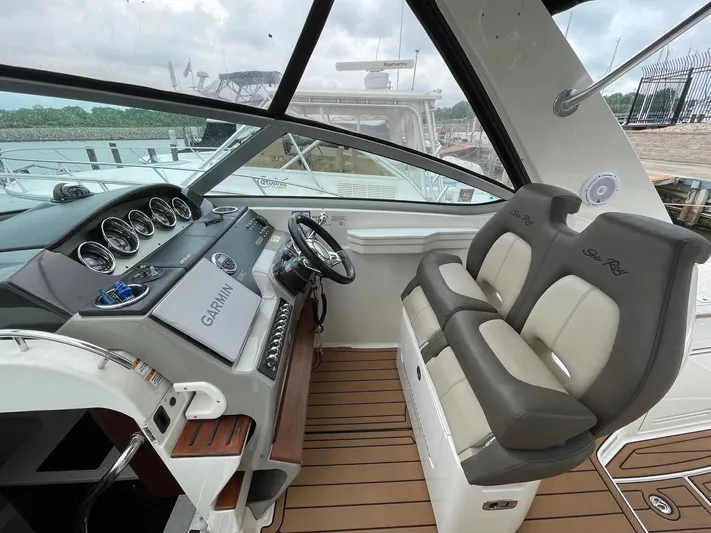  Yacht Photos Pics 2015 Sea Ray 350 Sundancer helm with Garmin navigation and dual seating.