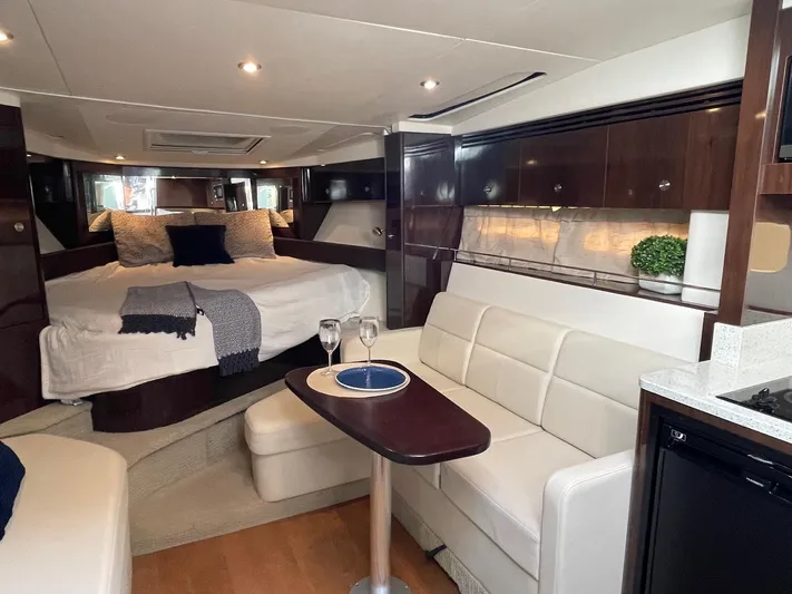  Yacht Photos Pics Interior of 2015 Sea Ray 350 Sundancer yacht with elegant seating and cozy bed.