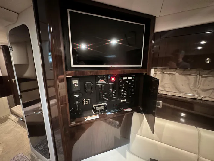  Yacht Photos Pics 2015 Sea Ray 350 Sundancer interior with control panel and TV.