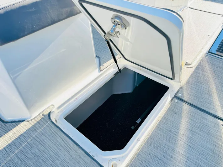  Yacht Photos Pics Open storage compartment on 2023 Cobalt R8 boat deck.
