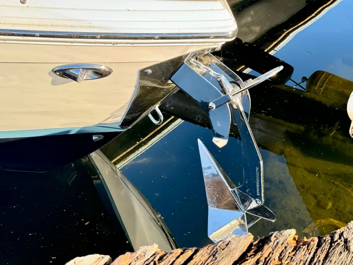  Yacht Photos Pics 2023 Cobalt R8 boat with shiny anchor reflected in water.