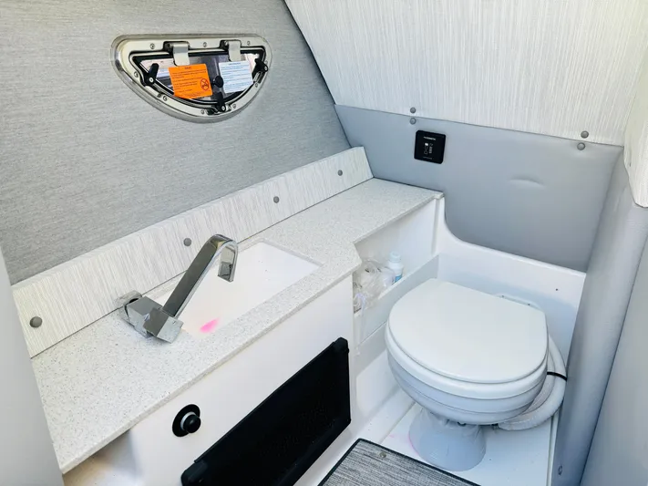  Yacht Photos Pics 2023 Cobalt R8 boat bathroom interior with sink and toilet.