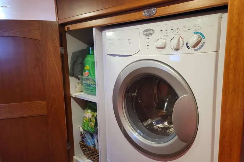Sea The Light Yacht Photos Pics Washing machine in the laundry area of a 2019 Endeavour Catamaran 440 HYBRID.