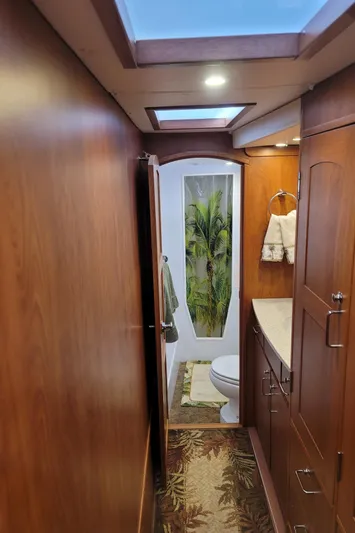 Sea The Light Yacht Photos Pics Interior of 2019 Endeavour Catamaran 440 HYBRID with wooden cabinetry and bathroom.
