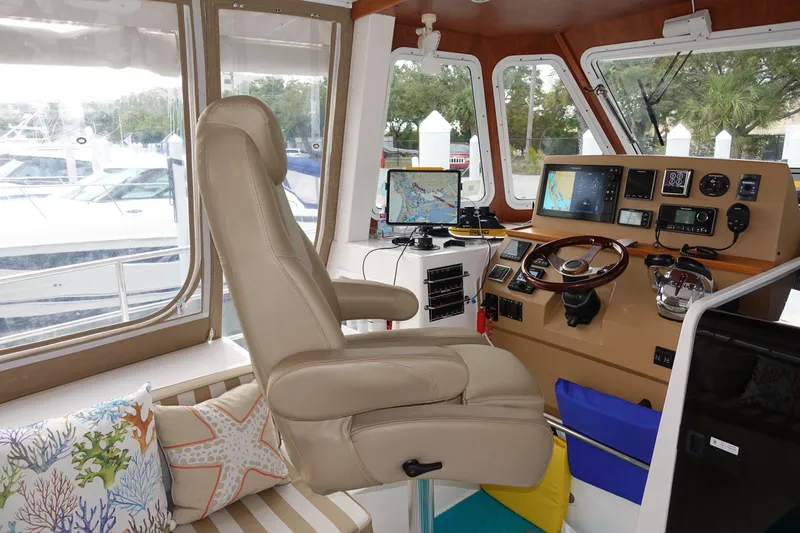 Sea The Light Yacht Photos Pics Interior helm station of 2019 Endeavour Catamaran 440 HYBRID with navigation equipment.