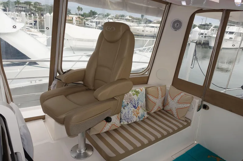 Sea The Light Yacht Photos Pics Captain's chair and seating area inside 2019 Endeavour Catamaran 440 HYBRID.