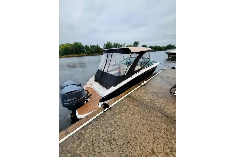  Yacht Photos Pics 2021 Regal 29 OBX boat docked with Yamaha outboard engines, covered canopy.
