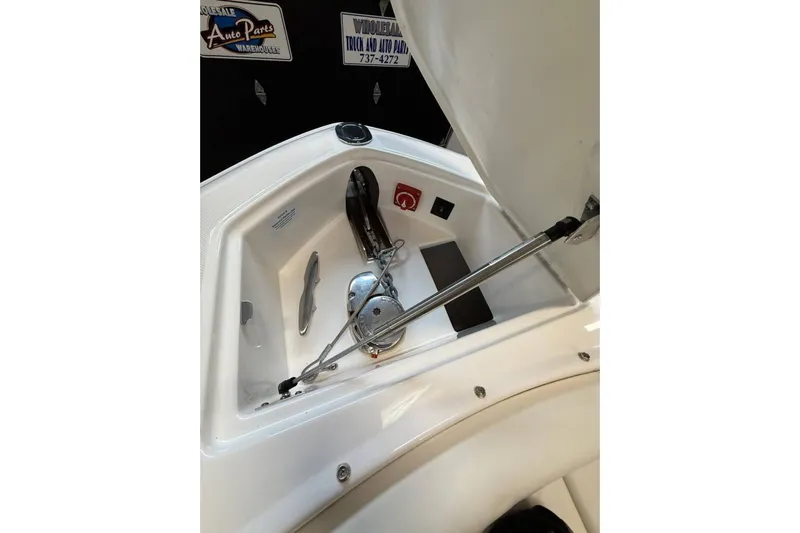  Yacht Photos Pics 2021 Regal 29 OBX boat anchor compartment with hydraulic support.
