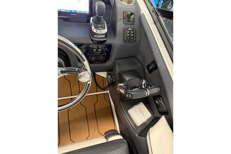  Yacht Photos Pics 2021 Regal 29 OBX boat helm with steering wheel and control panel.