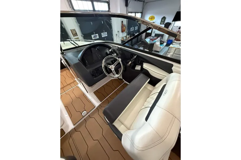  Yacht Photos Pics 2021 Regal 29 OBX boat interior with steering wheel and seating.
