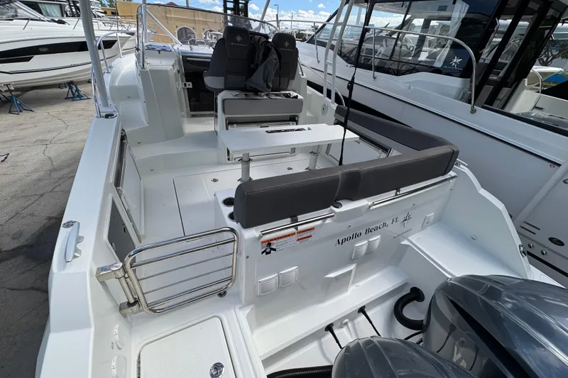  Yacht Photos Pics 2021 Jeanneau Leader 9.0 WA boat interior with seating and controls.
